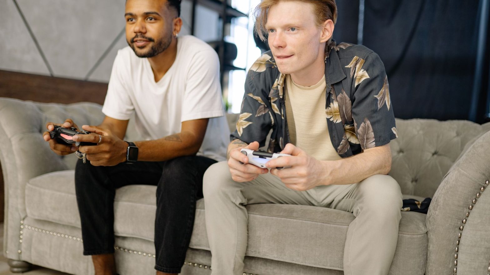 Two friends sitting on a sofa, playing video games together at home. — Direct Big Provider Slot Websites – Understanding Plat
